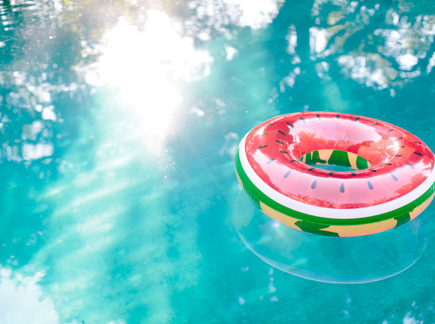 watermelon floatie by itself floating in a swimming pool